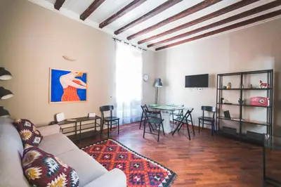 a living room with a couch and a table at Colosseum nest in Rome