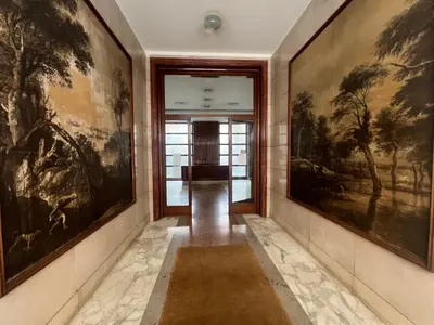 a hallway with paintings on the walls at Affreschi al Vaticano in Rome