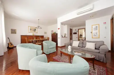 a living room with a couch and chairs and a table at TreasureRome Santa Maria Maggiore & Colosseum 3BR in Rome