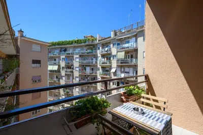 a balcony of a building with a table and chairs at La Meraviglia- San Pietro - Vatican Area in Rome