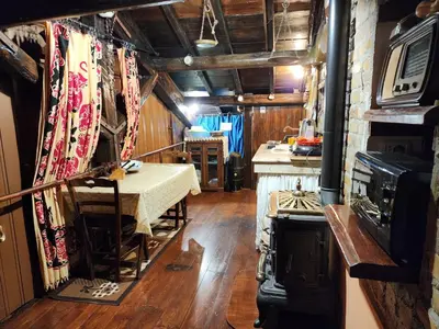 a room with a table and a stove in it at B&BGarbatella in Rome