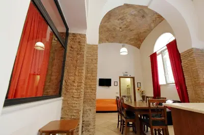 a dining room with a table and chairs at Lucky Holidays in Rome