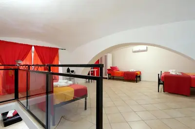 a room with two beds and a balcony at Lucky Holidays in Rome