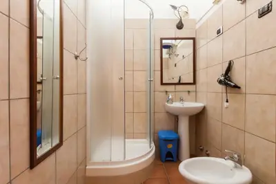a bathroom with a sink and a toilet and a shower at Furio Camillo in Rome