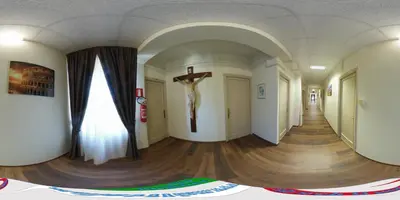 a cross on the wall of a hallway with a cross on the wall at Casa per Ferie Suore Domenicane in Rome