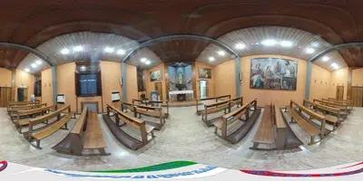 a large church with wooden pews in the middle at Casa per Ferie Suore Domenicane in Rome