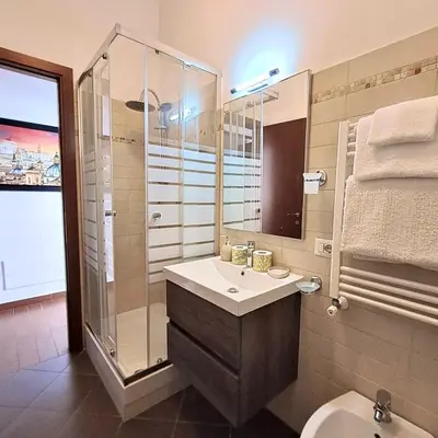 a bathroom with a sink and a shower and a toilet at Residenza San Pietro in Rome