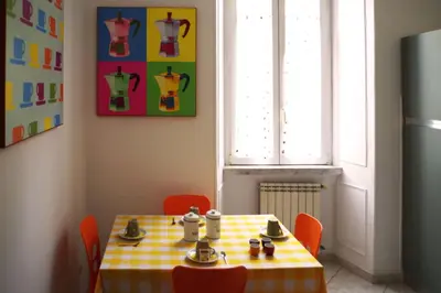 a table with a yellow and white checkered table cloth at Residenza San Pietro in Rome