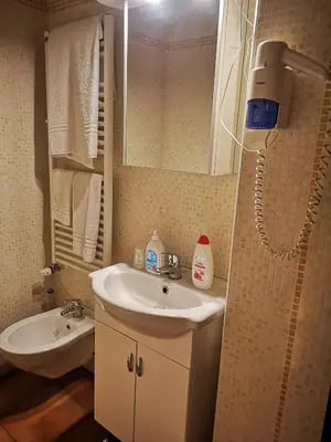 a bathroom with a sink and a mirror at Vecchia Roma Resort in Rome