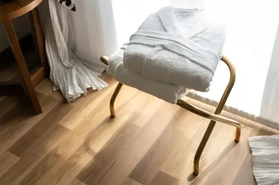 a towel sitting on a chair in a room at Barcaccia Luxury Suites in Rome