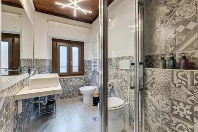 a bathroom with a shower and a sink and a toilet at Linhouse in Rome