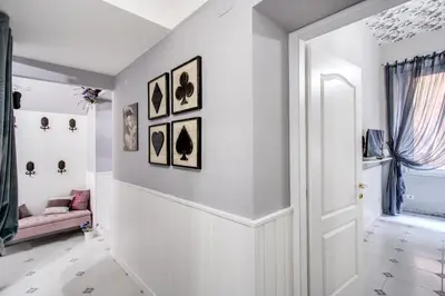 a hallway with white walls and a white door at Ripetta Miracle Suite in Rome