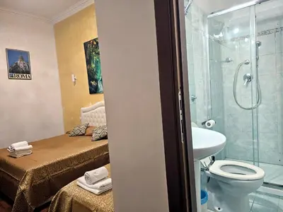 a bathroom with a shower and a toilet and a sink at Aquarium Termini in Rome