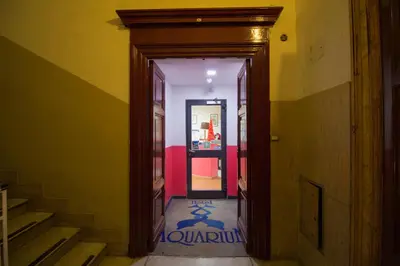 a hallway with an open door to a room at Aquarium Termini in Rome
