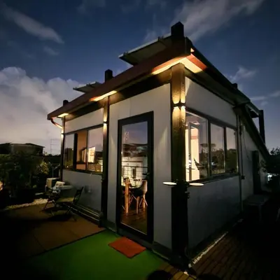 a small house with lights on the side of it at B&B Abbraccia Morfeo in Rome