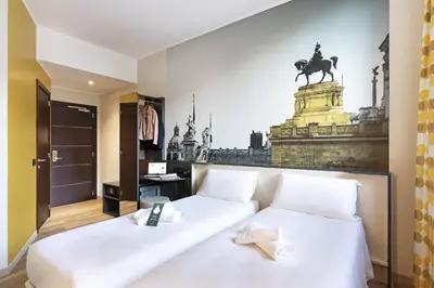 a bedroom with a bed with a statue of a horse on the wall at B&B Hotel Roma San Lorenzo Termini in Rome