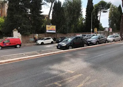 a group of cars parked on the side of a street at Appartamento Remanton in Rome
