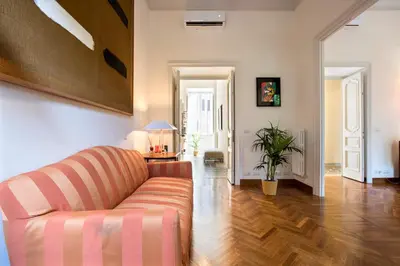 a living room with a couch and a table at Flat Three in Rome