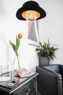 a desk with a black hat on top of it at Gallery Guesthouse in Rome