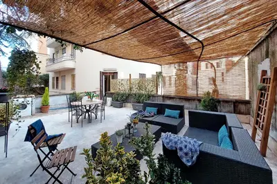 a living room with a couch and a table at Scipioni Terrace in Rome