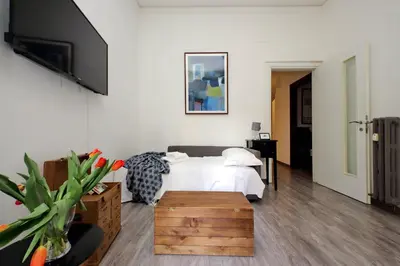 a living room with a table and a couch at Scipioni Terrace in Rome