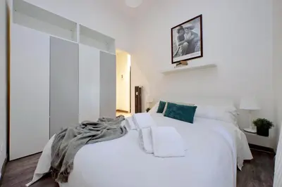 a white kitchen with a sink and a microwave at Scipioni Terrace in Rome