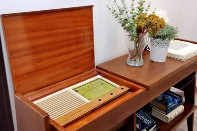 a wooden table with a laptop on top of it at Scipioni Terrace in Rome