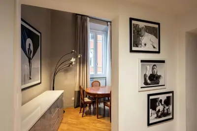 a hallway with a dining room with a table at Piazza di Spagna Moda Luxury Apartment in Rome