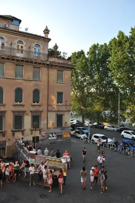 a group of people standing in front of a building at Core De Roma Suites in Rome