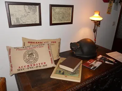 a table with a pillow and books on it at Le Fate Apartments in Rome