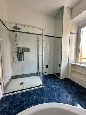 a bathroom with a shower and a tub at Vatican Color House in Rome