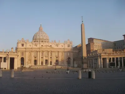 a large building with a tower in front of it at Emma's Apartment Borgo, Vatican City in Rome