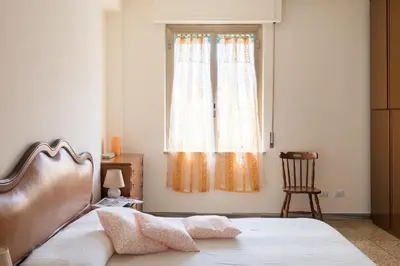 a bedroom with a bed and a window at Hortis Apartment, 5 persone, 2 camere, balcone, Metro C per il Colosseo a 10 minuti e tram per Termini a 2 minuti in Rome