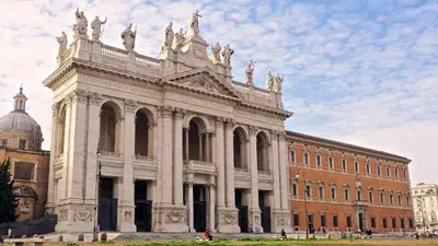 a large building in front of a brick building at Rhome202 in Rome