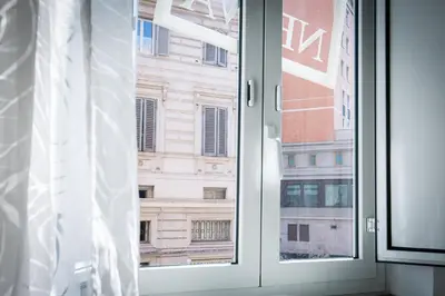 an open window with a view of a building at Nerva Accommodation in Rome
