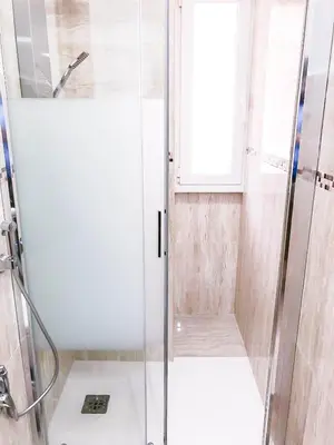 a shower with a glass door in a bathroom at San Pietro Home in Rome