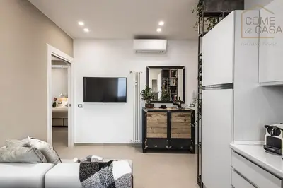a living room with a couch and a tv at Come a Casa in Rome