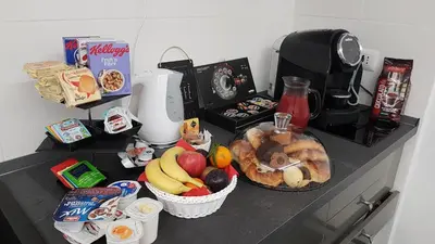 a counter top with a bunch of food on it at VaticanArt in Rome