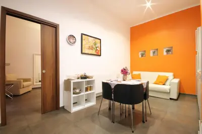 a living room with a table and a couch at Vatication B&B in Rome