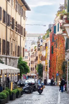 a group of motorcycles parked on a city street at Classic Flat Monti in Rome