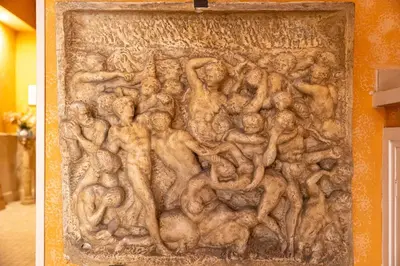 a relief on the side of a wall at Classic Flat Monti in Rome
