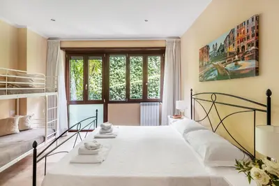 a bedroom with a bed and a window at ROMAN DREAM I in Rome