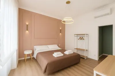 a bedroom with a bed with two towels on it at B&B Aurelia Garden Rooms in Rome