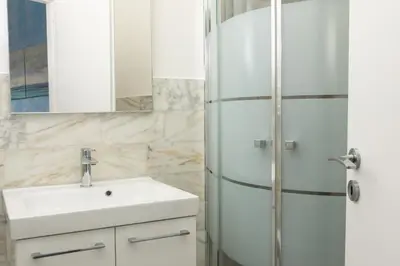 a bathroom with a sink and a shower at Bibbi's House San Lorenzo in Rome