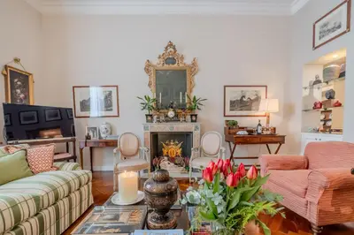 a living room with a couch and a fireplace at Colonna Traiana - The View Boutique Luxury Home in the center of ancient Rome in Rome