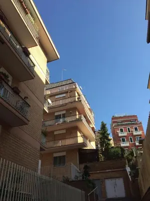 an apartment building with balconies on the side of it at Alloggio Turistico Roberta San Pietro in Rome