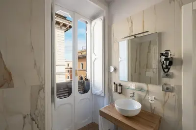 a room with a painting on the wall at Hotel Caravita in Rome
