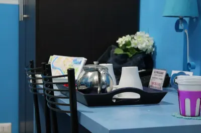 a blue table with a black basket on top of it at Aracoeli in Rome
