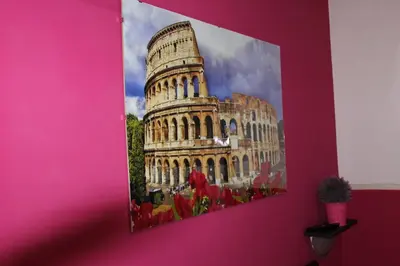 a picture of the leaning tower on a pink wall at Aracoeli in Rome