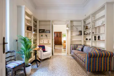 a living room with a couch and a chair at Flat Two in Rome